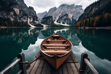 Wooden rowboat on a serene mountain lake