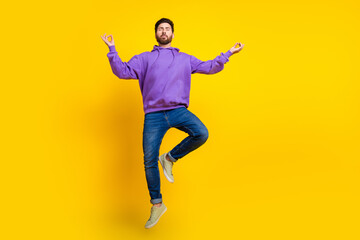 Canvas Print - Full size photo of handsome young guy flying meditate wear trendy violet outfit isolated on yellow color background