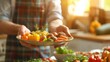 © Artyom - Person holding plate with various fresh vegetables in kitchen