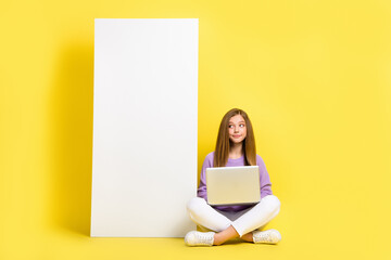 Poster - Full length photo of minded lady user sit big white board look empty space dream modern device smartphone isolated yellow color background