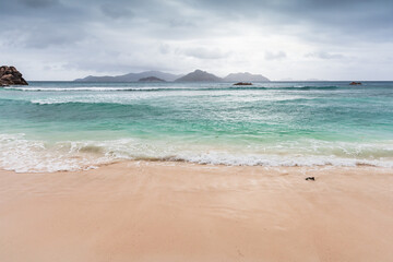 Wall Mural - La Digue beach view on a cloudy day