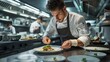 © YURY YUTY - Chef meticulously plates gourmet dish in a bustling restaurant kitchen.