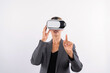 © InfiniteFlow - Professional female leader touching at program or working while using VR glasses. Skilled businesswoman pointing at system while connecting at metaverse by wearing visual reality goggles. Contraption.