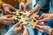 © Robert - Business team trying to find solution to problem together. Group of young people holding parts of jigsaw puzzle.
