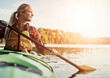 © Reese Coop/peopleimages.com - Hobby, river and woman rowing kayak outdoor for holiday, leisure or vacation in fresh air of nature. Adventure, travel and water with happy tourist person thinking in lake for break, journey or trip
