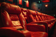 © john - A row of red leather seats in a traditional movie theater setup