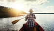 © Reese Coop/peopleimages.com - Person, kayaking and back or paddling on river, relax and water travel or hobby in boat on holiday weekend. Adventure, lake and rowing or tourist activity, calm and outdoor break for fitness