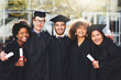 © ClearConcept/peopleimages.com - Graduation, achievement or portrait of students with smile at university for education, opportunity or success. College, happy or group of people hug at campus with knowledge, scholarship or diploma