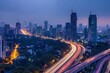 © Road Red Runner - A night time aerial view of Mumbais skyline, featuring a highway with bright light trails.