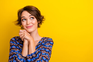 Canvas Print - Portrait of young lovely girlfriend clasped hands looking empty space promotion new cosmetics products isolated on yellow color background