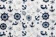 © Daniel - Minimalist pattern with anchors, ship wheels, and compasses, navy blue and white color scheme