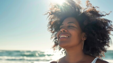 Poster - A happy woman relaxing on the beach with curly hair, perfect for summer vibes and vacation themes