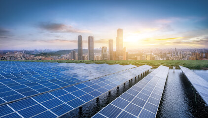 Modern Solar Panels with Cityscape at Sunset