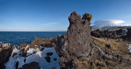 Wall Mural - Russia. Far East, Kuril Islands. Very hard and sharp basalt rocks along the coast of the Sea of Okhotsk on the island of Iturup.