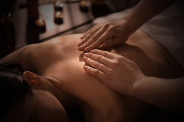 Canvas Print - Beautiful young woman lying on table during massage in salon, closeup