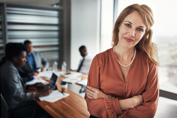 Wall Mural - Office, meeting and portrait of business woman with crossed arms for planning, collaboration and teamwork. Corporate, professional and happy manager with workers for coworking, feedback and training