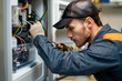 © Ala - Male Technician Repairing Refrigerator With Screwdriver