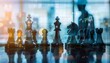 © Pornarun - Chess pieces on a table with a blurred city background and a businessman silhouette, symbolizing strategic planning and leadership.
