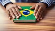 © Rmcarvalhobsb - Educação - Brasil. Um estudante brasileiro com um livro sobre a mesa que tem a capa em referência ao Brasil. Estudar, exame nacional do ensino médio.