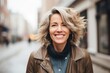 © CojanAI - Portrait of a smiling middle aged American woman in the city