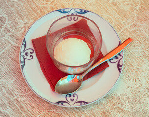 Poster - Service dish containing sweet lemon sorbet on the laid table in restaurant
