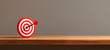 © Наталья Лазарева - banner with place for text,red and white target,in center of which an arrow hits, symbolizes success in business, on a wooden background. ideal for illustrating achievement of goals,strategic planning