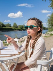 Poster - A little girl sitting at a table with her finger pointed, AI