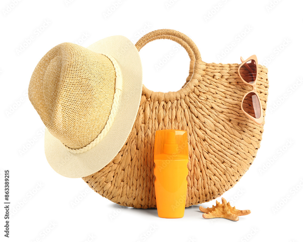 Bottle of sunscreen cream with beach accessories isolated on white background