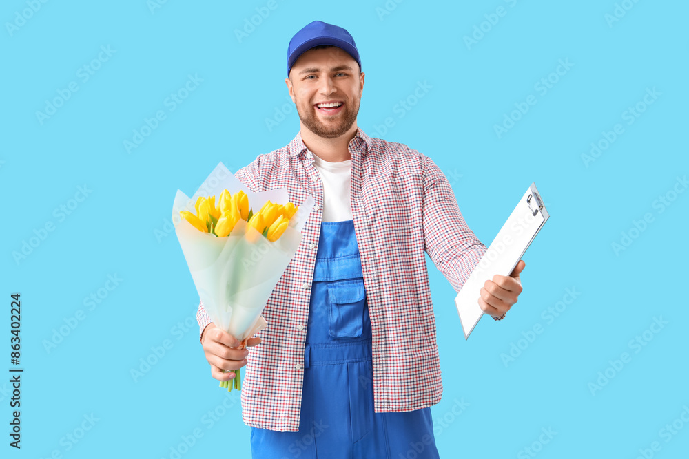 Delivery man with flowers and clipboard on blue background