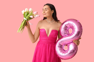 Wall Mural - Beautiful young woman with pink air balloon in shape of figure 8 and bouquet of tulips on color background. International Women's Day