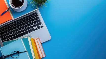 Aufkleber - A blue desk with a laptop, textbooks, and a cup of coffee. A modern and contemporary learning environment. Generative AI