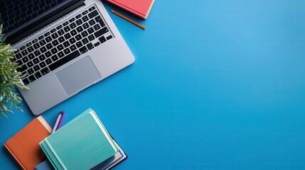 Leinwandbilder - A laptop and textbooks are placed on a blue desk, symbolizing the combination of traditional and digital learning methods. Generative AI