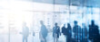 © javu - Silhouettes of business people walking in modern office with double exposure of blurry cityscape and financial charts.