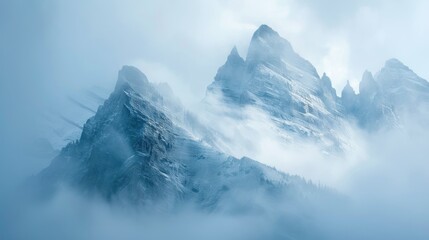 Rocky Mountain range covered in thick fog and mist