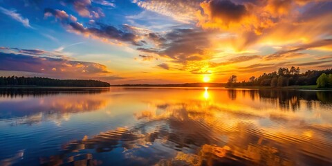 Wall Mural - Sunset casting a warm glow over a calm lake , evening, dusk, tranquil, reflection, nature, beauty, serene, water, sky