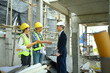 © Prathankarnpap - Businessmen or investor having a conversation and shaking hands with engineer team construction site