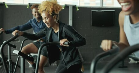 Wall Mural - Fitness, women and fist bump for exercise bike challenge at gym with motivation, luck and cardio performance. Sports, club and friends with spinning class agreement, success or progress celebration