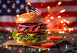 © ink drop - A freshly made beef burger with an american stars and stripes flag. USA holiday food