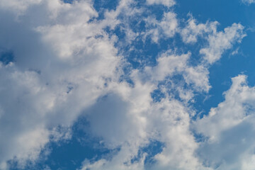 Wall Mural - white clouds almost completely covered the blue of the clear sky. background for art blanks, wallpap