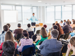 Wall Mural - business and entrepreneurship symposium. speaker giving a talk at business meeting. audience in conf