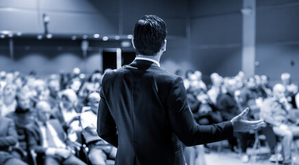 Wall Mural - speaker at business conference with public presentations. audience at the conference hall. entrepren