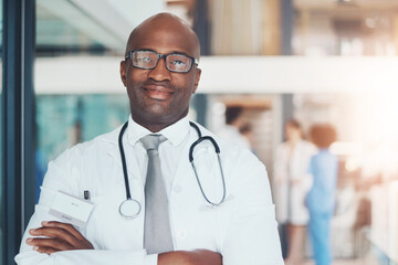 Poster - Doctor, portrait and confidence of black man for healthcare, wellness or medical experience with stethoscope. Hospital, smile and pride in health facility with crossed arms for cardiology or medicine