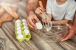 © Valerii Apetroaiei - Baking is a fun activity for parent and child, cracking eggs and mixing ingredients in the kitchen