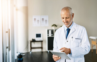 Canvas Print - Man, doctor and browsing on tablet in clinic, online healthcare and telehealth or searching for medical research. Wellness, insurance and hospital professional, diagnosis and internet consultation