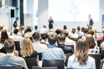 Wall Mural - business and entrepreneurship symposium. speaker giving a talk at business meeting. audience in conf