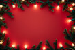 © Anastasiia Havelia - Christmas lights garland border on red background with copy space, view from above