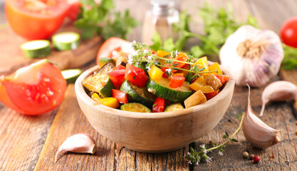 Poster - traditional homemade vegetable ratatouille in bowl with rosemary herbs