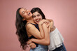 © Royaltyfreecliick - Two Lovely Ladies Laughing While Hugging