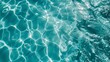 © woters - Rippling turquoise water in a pool on a sunny day