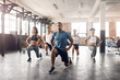 © peopleimages.com - People, training and lunge in group at gym for workout, core exercise or fitness together indoors. Diverse class, friends or warm up for ab muscle, session and sport for health challenge in gymnasium